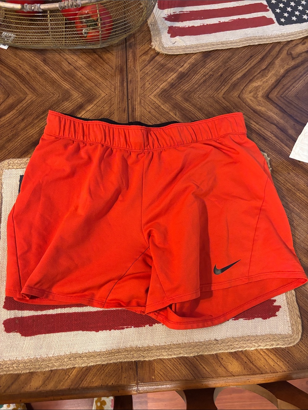 Nike Women’s Orange Athletic Running Shorts with Black Swoosh